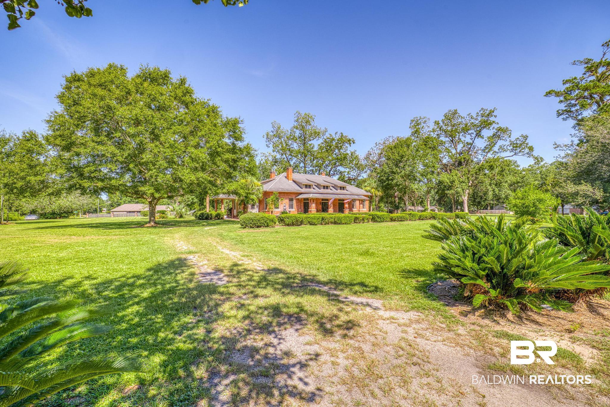 1701 Sowell Road Brewton, AL 36426 - Photo 4 of 83 View of grassy yard with view of scattered trees