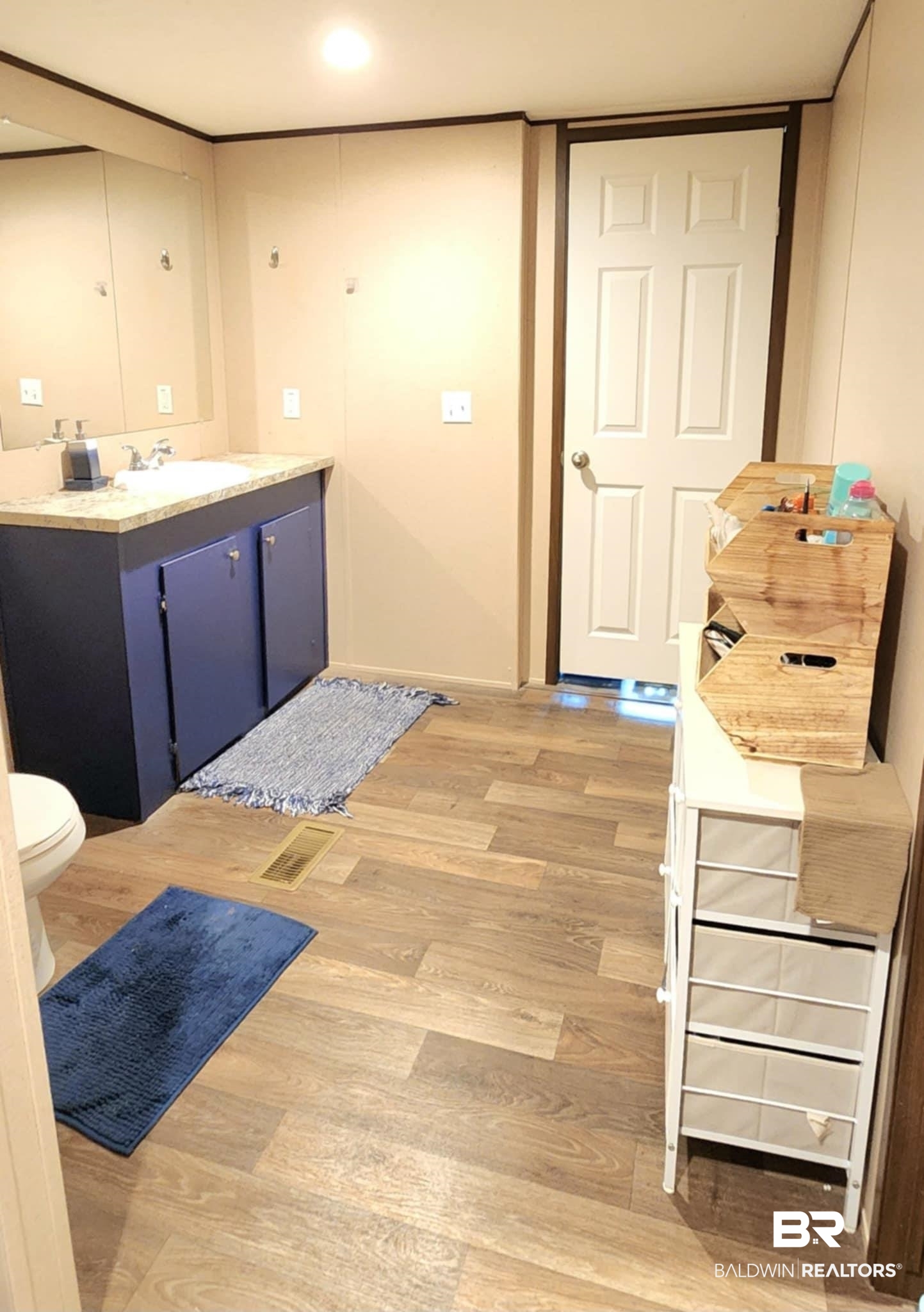25474 Waterworld Road Robertsdale, AL 36567 - Photo 20 of 30 Bathroom featuring light wood finished floors and vanity