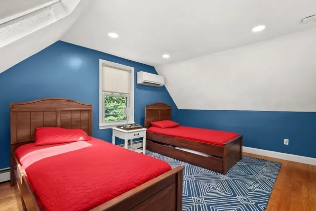 a bedroom with bed and window