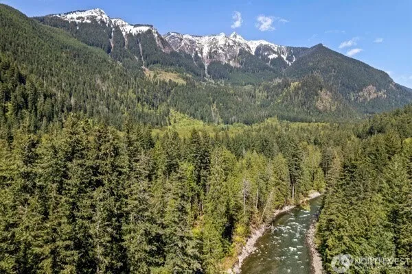 a view of a big yard with mountains in the background