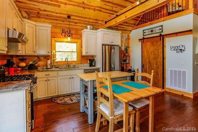 91 Zachary Lane Rutherfordton, NC 28139 - Photo 11 of 37 a kitchen that has a sink and a wooden floor