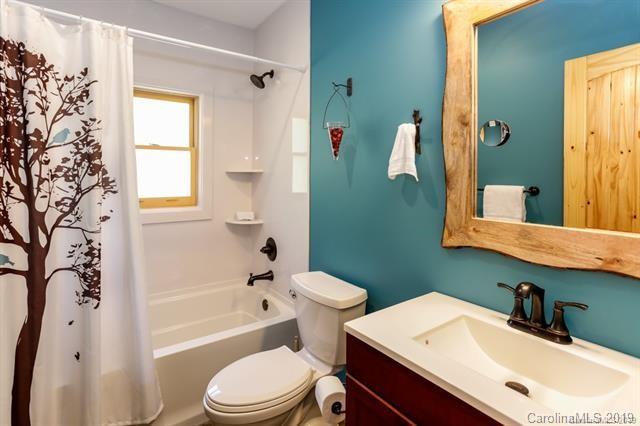 91 Zachary Lane Rutherfordton, NC 28139 - Photo 14 of 37 a bathroom with a sink toilet and shower