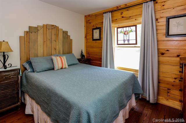 91 Zachary Lane Rutherfordton, NC 28139 - Photo 16 of 37 a bedroom with a bed and wooden floor