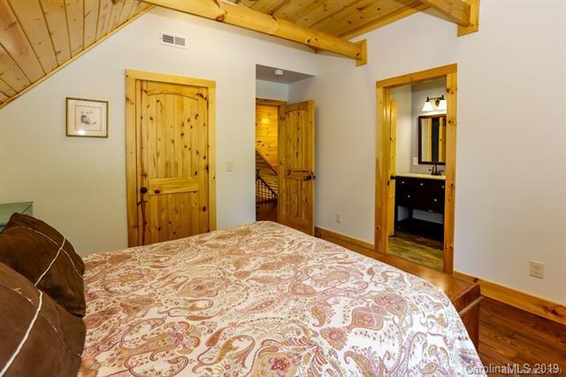 91 Zachary Lane Rutherfordton, NC 28139 - Photo 23 of 37 a bedroom with a bed and wooden floor