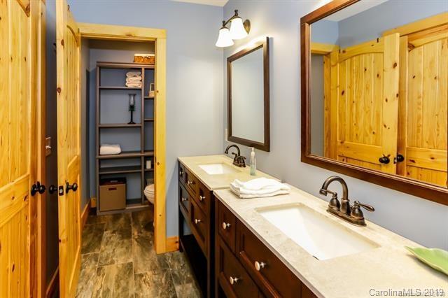 91 Zachary Lane Rutherfordton, NC 28139 - Photo 25 of 37 a bathroom with a double vanity sink and a mirror