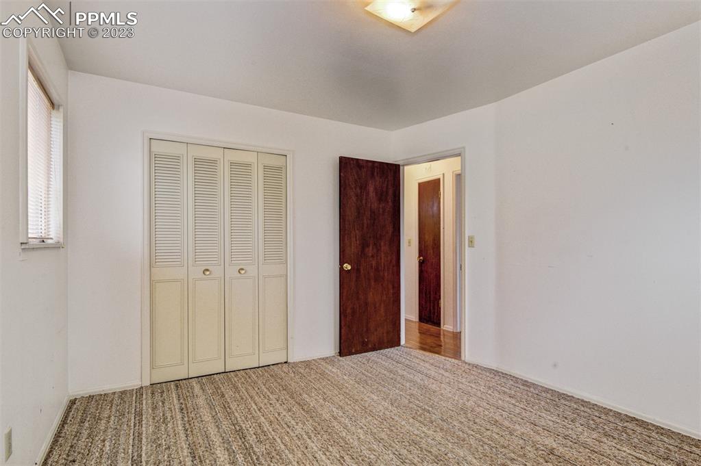 5380 Babcock Court Colorado Springs, CO 80915 - Photo 11 of 28 a view of empty room with wooden floor