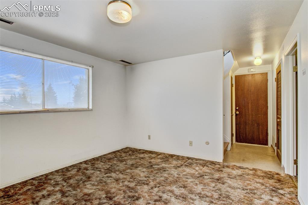 5380 Babcock Court Colorado Springs, CO 80915 - Photo 13 of 28 a view of a room with a wooden floor and cabinets