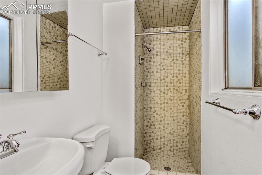 5380 Babcock Court Colorado Springs, CO 80915 - Photo 17 of 28 a bathroom with a sink toilet and shower