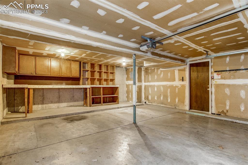 5380 Babcock Court Colorado Springs, CO 80915 - Photo 19 of 28 a view of an empty room with wooden cabinet and a empty space