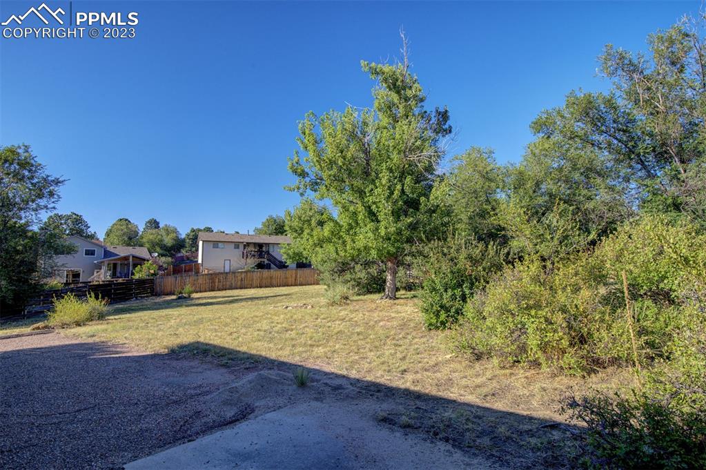 5380 Babcock Court Colorado Springs, CO 80915 - Photo 20 of 28 a view of a house with a yard