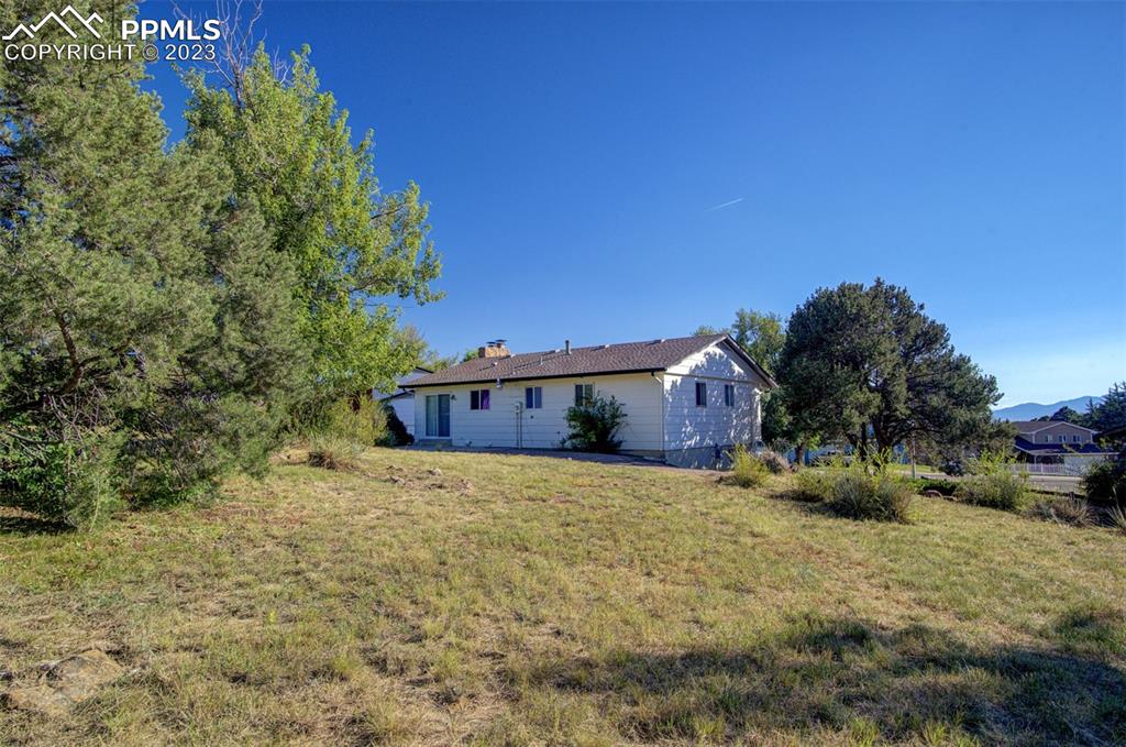 5380 Babcock Court Colorado Springs, CO 80915 - Photo 23 of 28 a view of a house with a yard