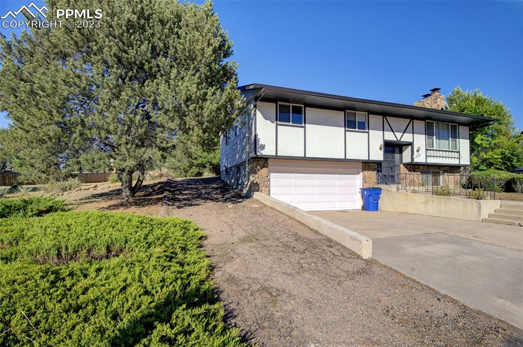5380 Babcock Court Colorado Springs, CO 80915 - Photo 25 of 28 a front view of a house with a yard