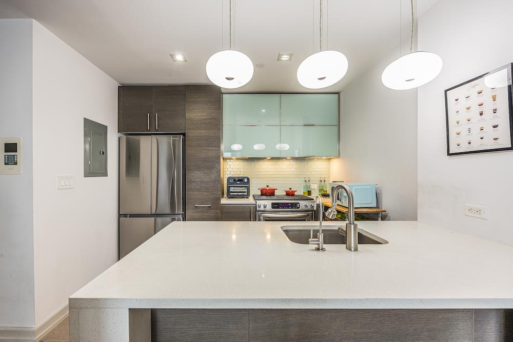 a kitchen with a table and chairs in it