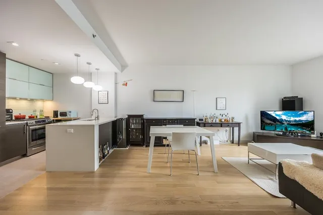 a kitchen with a table and chairs in it