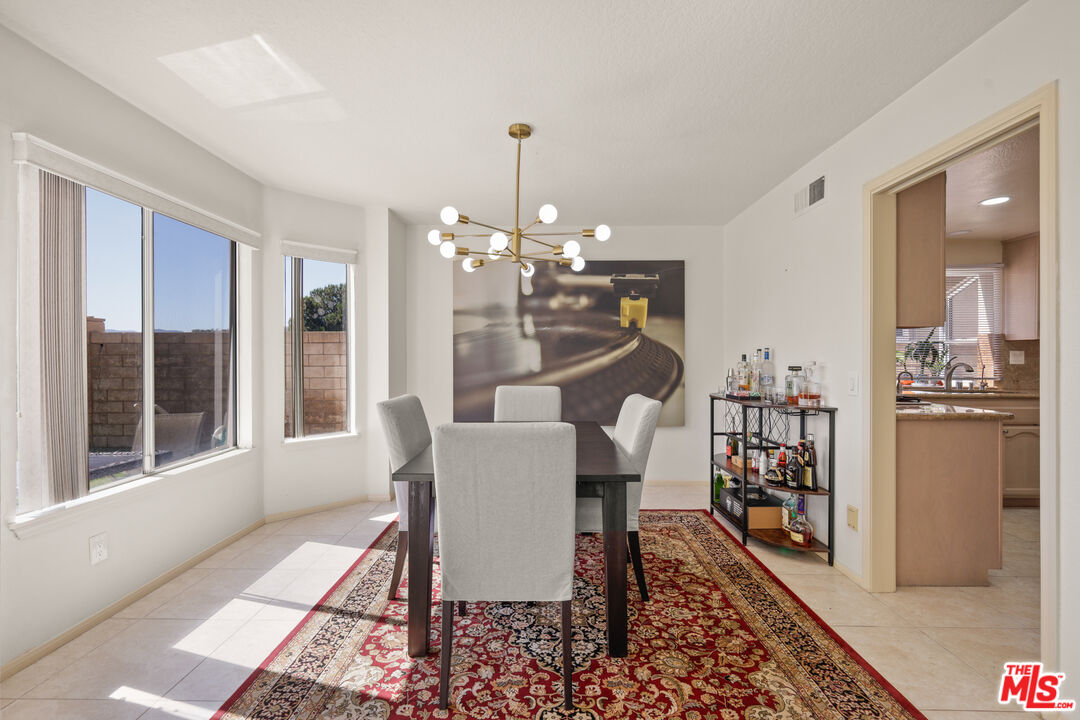 12119 Falcon Crest Way Porter Ranch, CA 91326 - Photo 11 of 51 a view of a dining room with furniture window and wooden floor