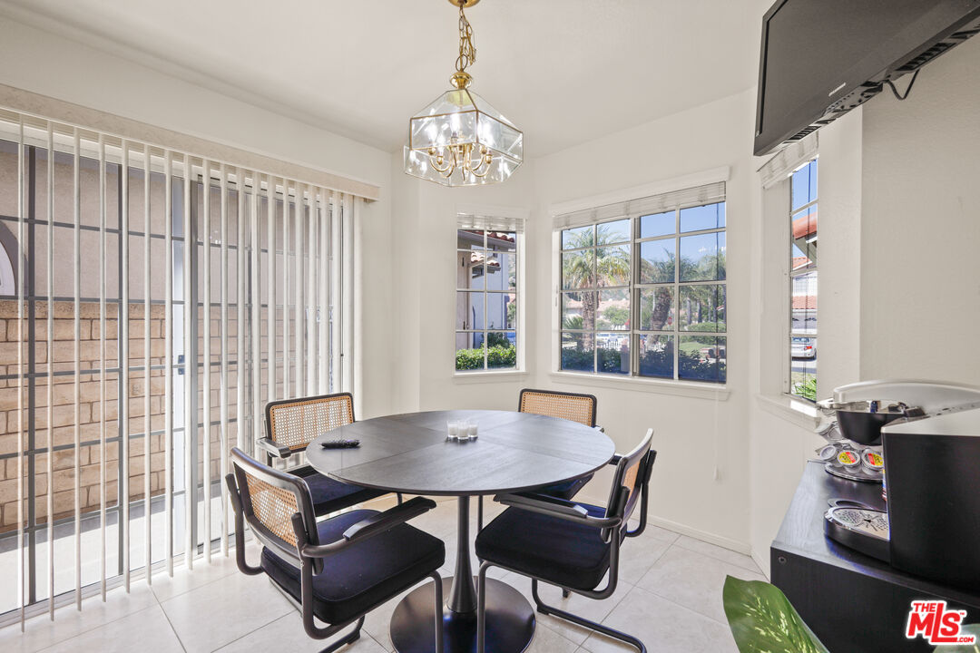 12119 Falcon Crest Way Porter Ranch, CA 91326 - Photo 18 of 51 a view of a dining room with furniture and window