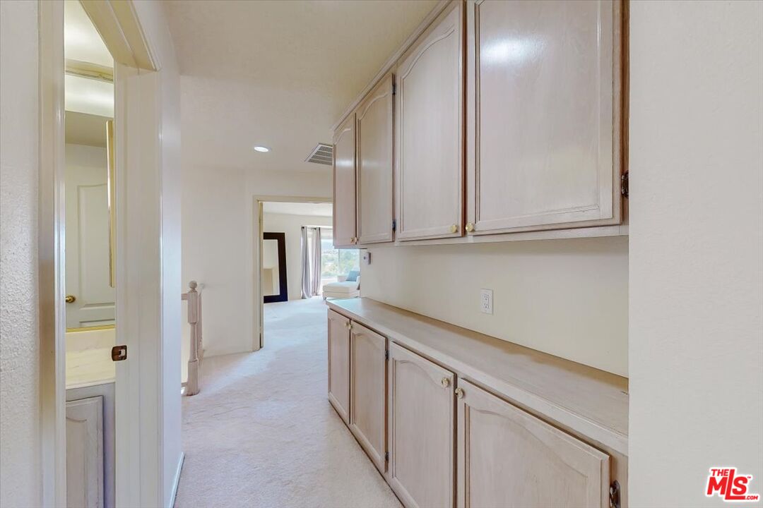 12119 Falcon Crest Way Porter Ranch, CA 91326 - Photo 26 of 51 a kitchen with stainless steel appliances granite countertop a refrigerator and a sink