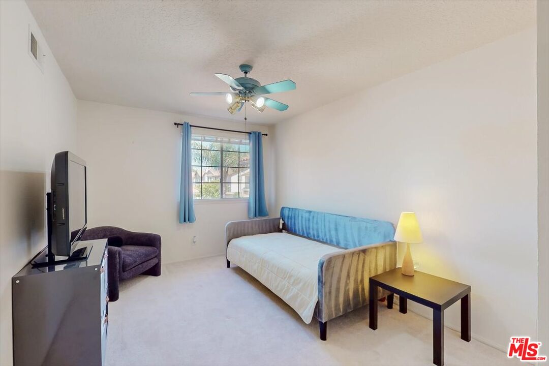 12119 Falcon Crest Way Porter Ranch, CA 91326 - Photo 29 of 51 a bedroom with furniture and a window