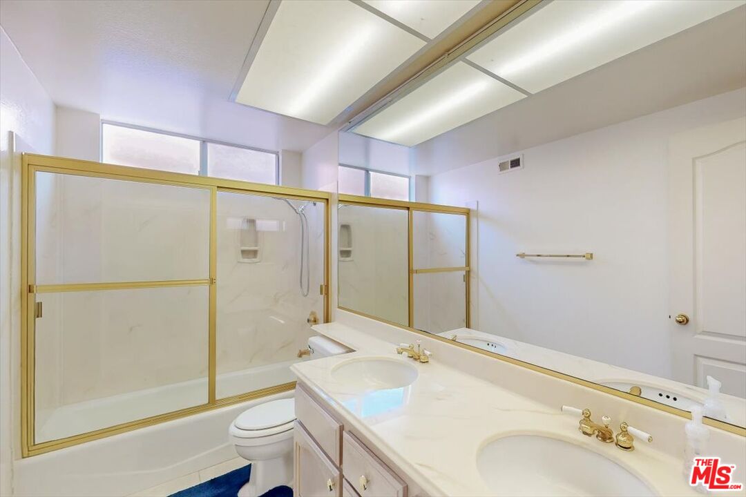 12119 Falcon Crest Way Porter Ranch, CA 91326 - Photo 31 of 51 a bathroom with a sink toilet and shower