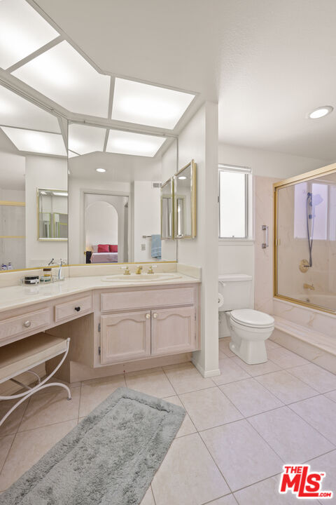 12119 Falcon Crest Way Porter Ranch, CA 91326 - Photo 39 of 51 a spacious bathroom with a granite countertop sink a toilet and a mirror