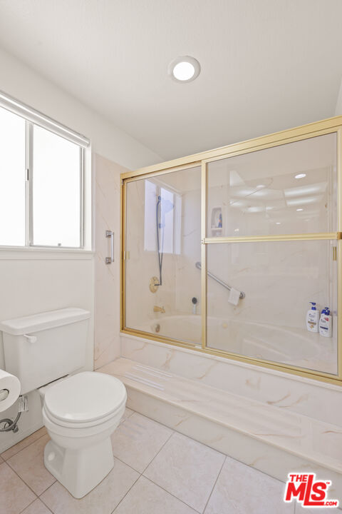 12119 Falcon Crest Way Porter Ranch, CA 91326 - Photo 40 of 51 a bathroom with a toilet and a shower