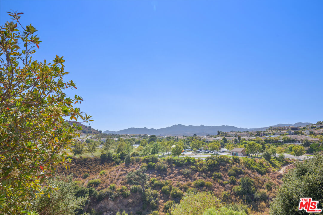 12119 Falcon Crest Way Porter Ranch, CA 91326 - Photo 45 of 51 a view of a city with lush green forest