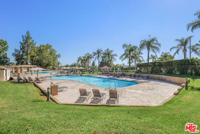 a view of a swimming pool with a patio