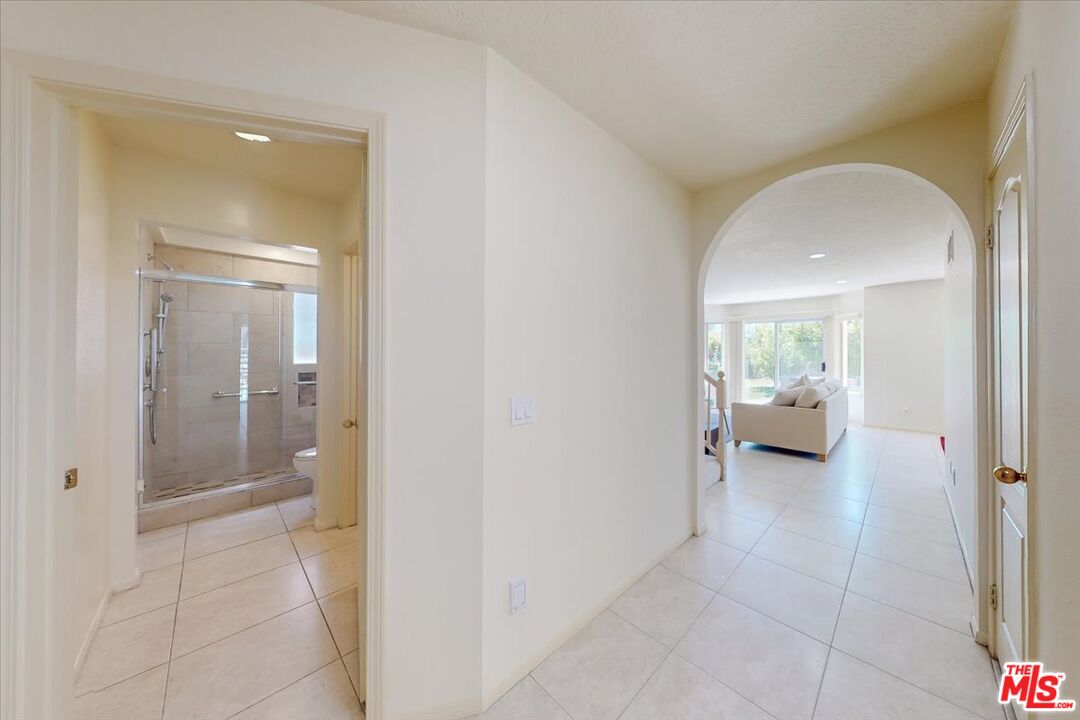 12119 Falcon Crest Way Porter Ranch, CA 91326 - Photo 6 of 51 a view of a hallway view with three rooms and a livingroom with furniture