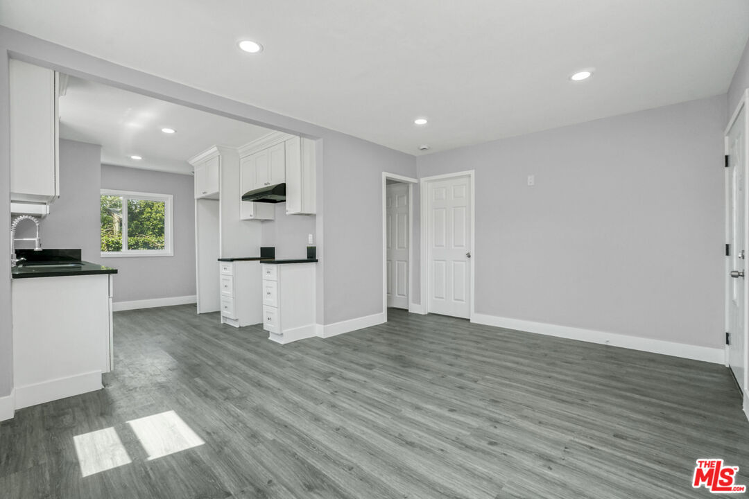1256 Exposition Boulevard Los Angeles, CA 90007 - Photo 15 of 28 a view of a kitchen with wooden floor and electronic appliances