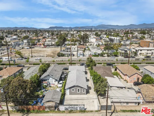 an aerial view of a house with a yard and garden