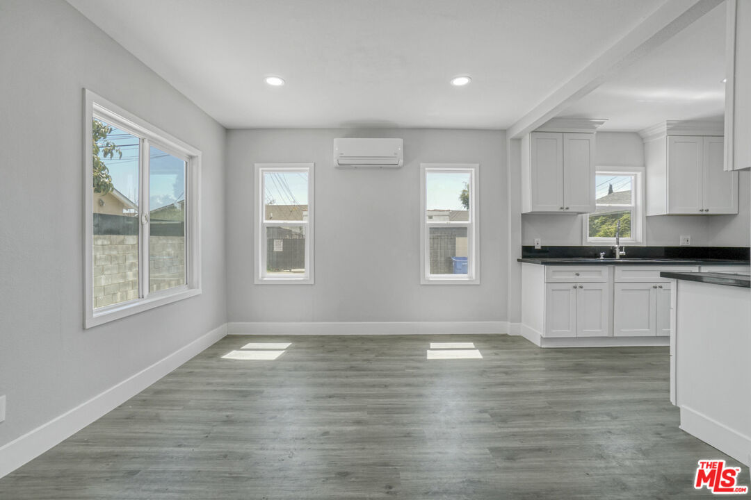 1256 Exposition Boulevard Los Angeles, CA 90007 - Photo 10 of 28 a view of kitchen with granite countertop cabinets and wooden floor