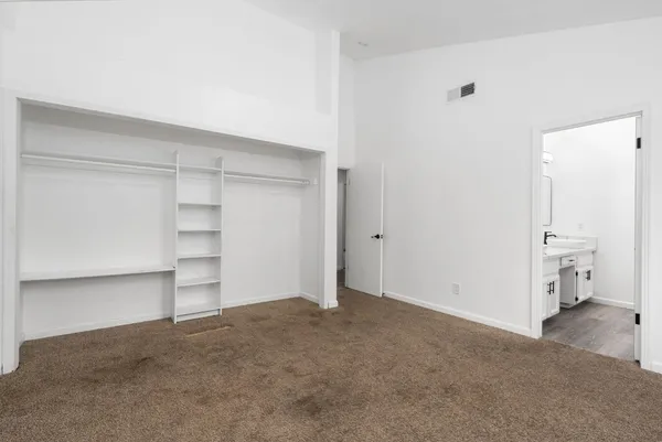 a bathroom with a double vanity sink and mirror