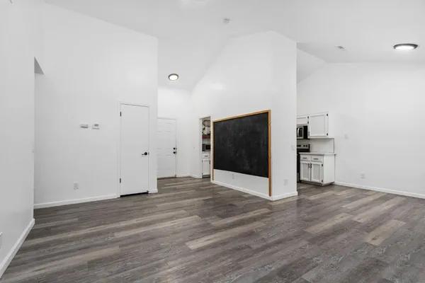 a view of a kitchen with wooden floor