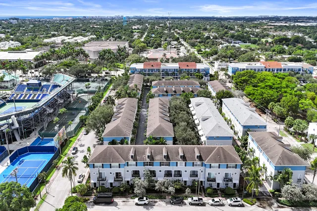an aerial view of residential houses with city view