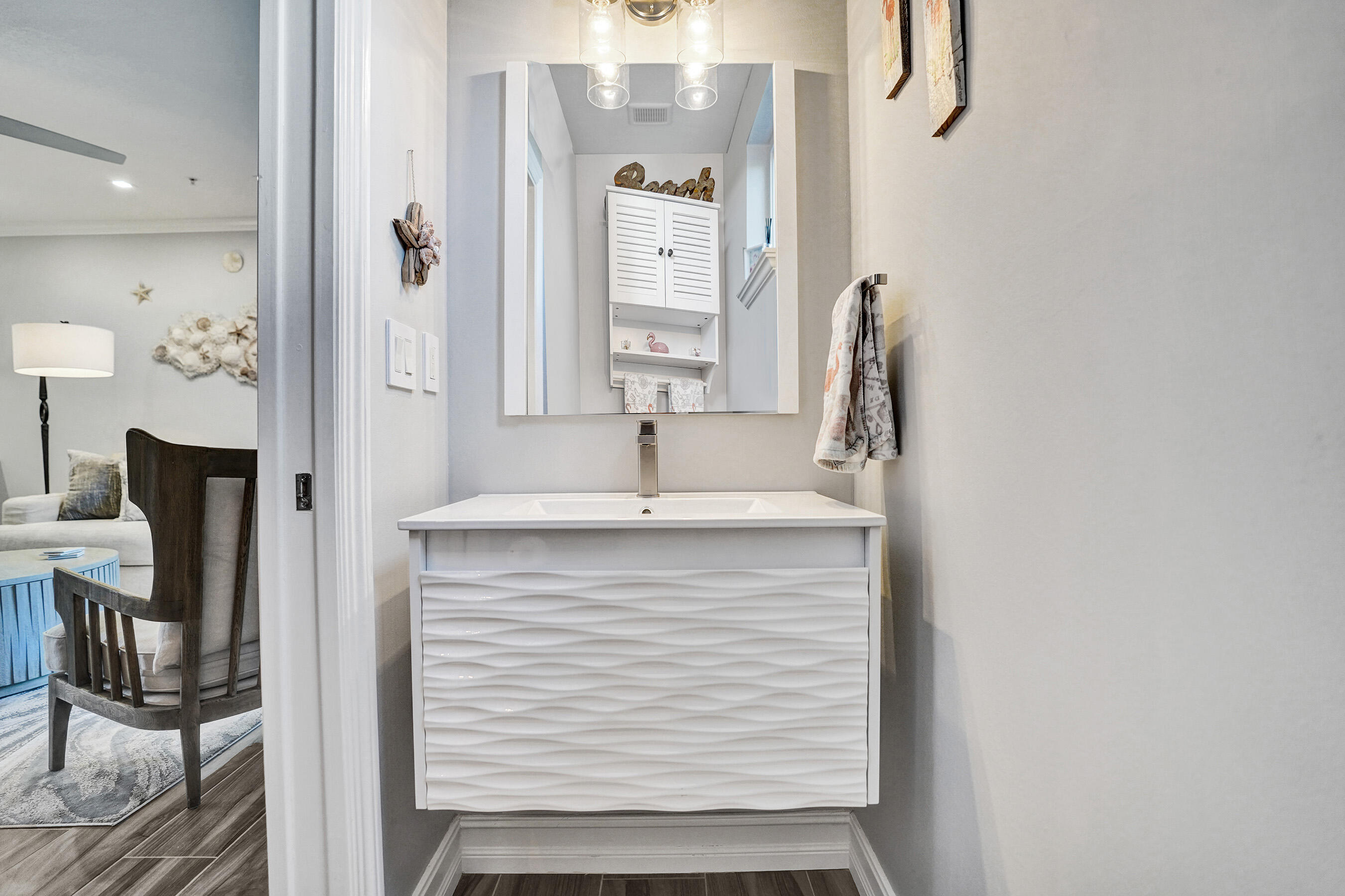 314 Northwest 1st Street Delray Beach, FL 33444 - Photo 12 of 26 a bathroom with a sink and a mirror