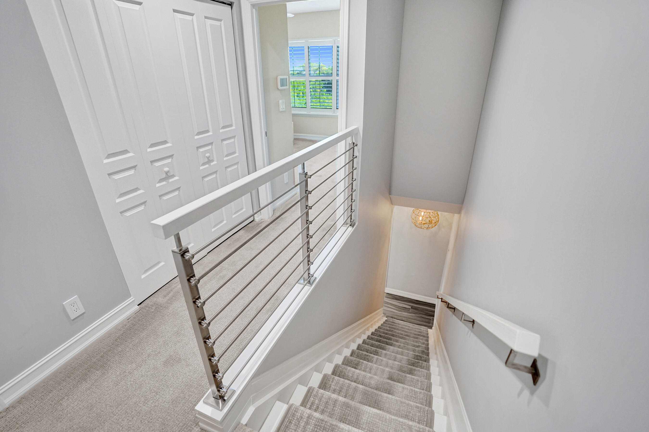 314 Northwest 1st Street Delray Beach, FL 33444 - Photo 13 of 26 a view of staircase with white walls and a window