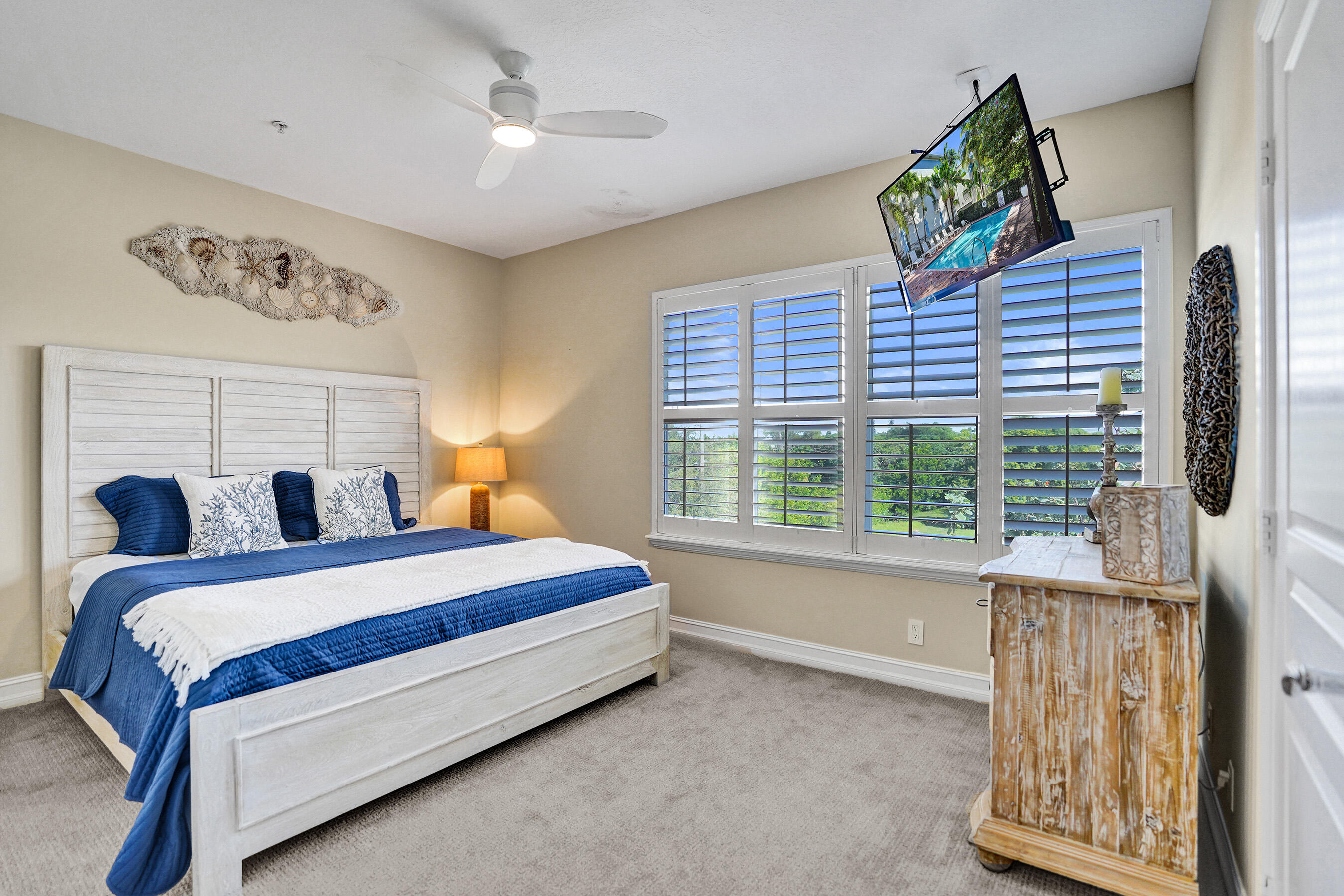 314 Northwest 1st Street Delray Beach, FL 33444 - Photo 14 of 26 a bed sitting in a room next to a window