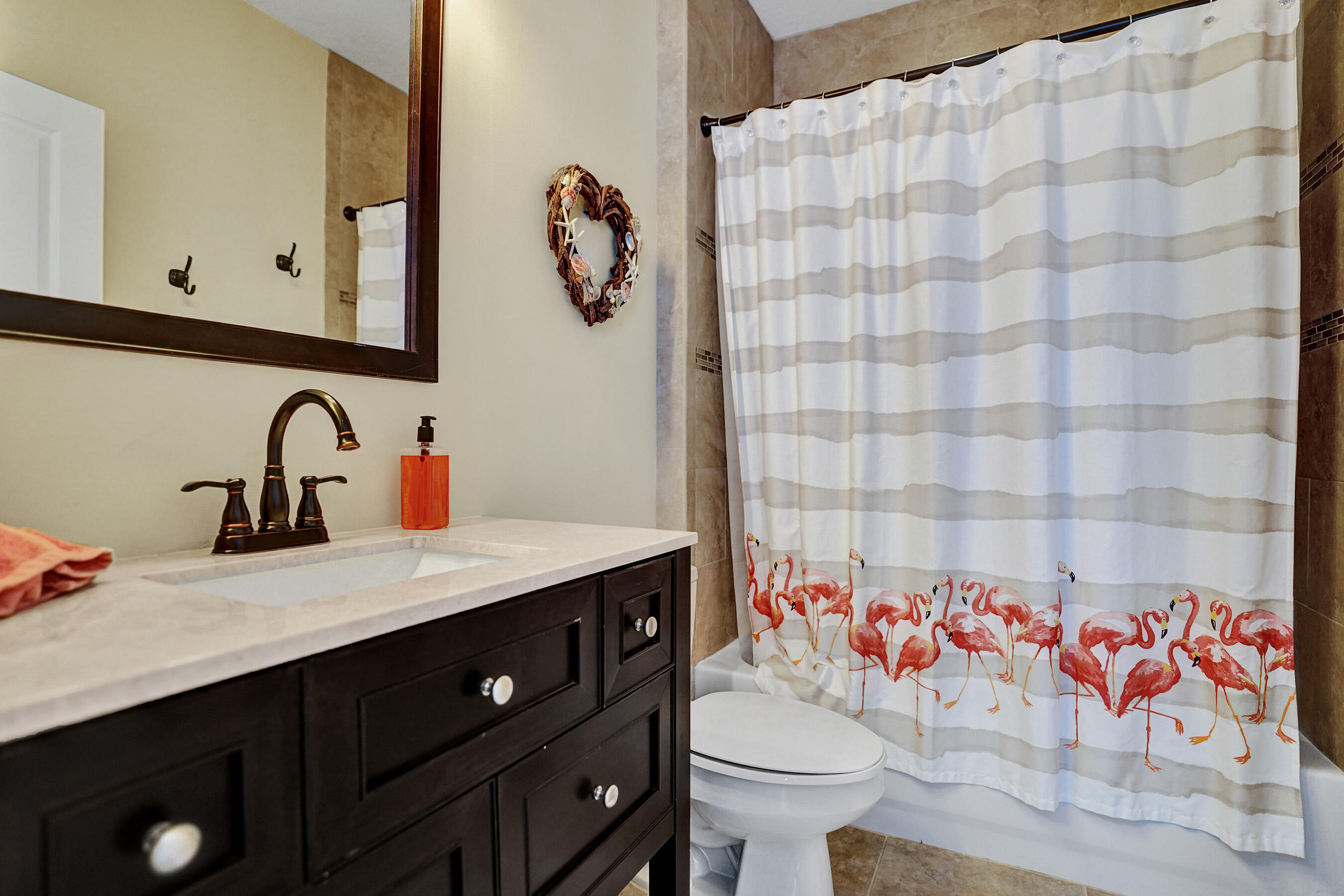 314 Northwest 1st Street Delray Beach, FL 33444 - Photo 19 of 26 a bathroom with a sink and a mirror