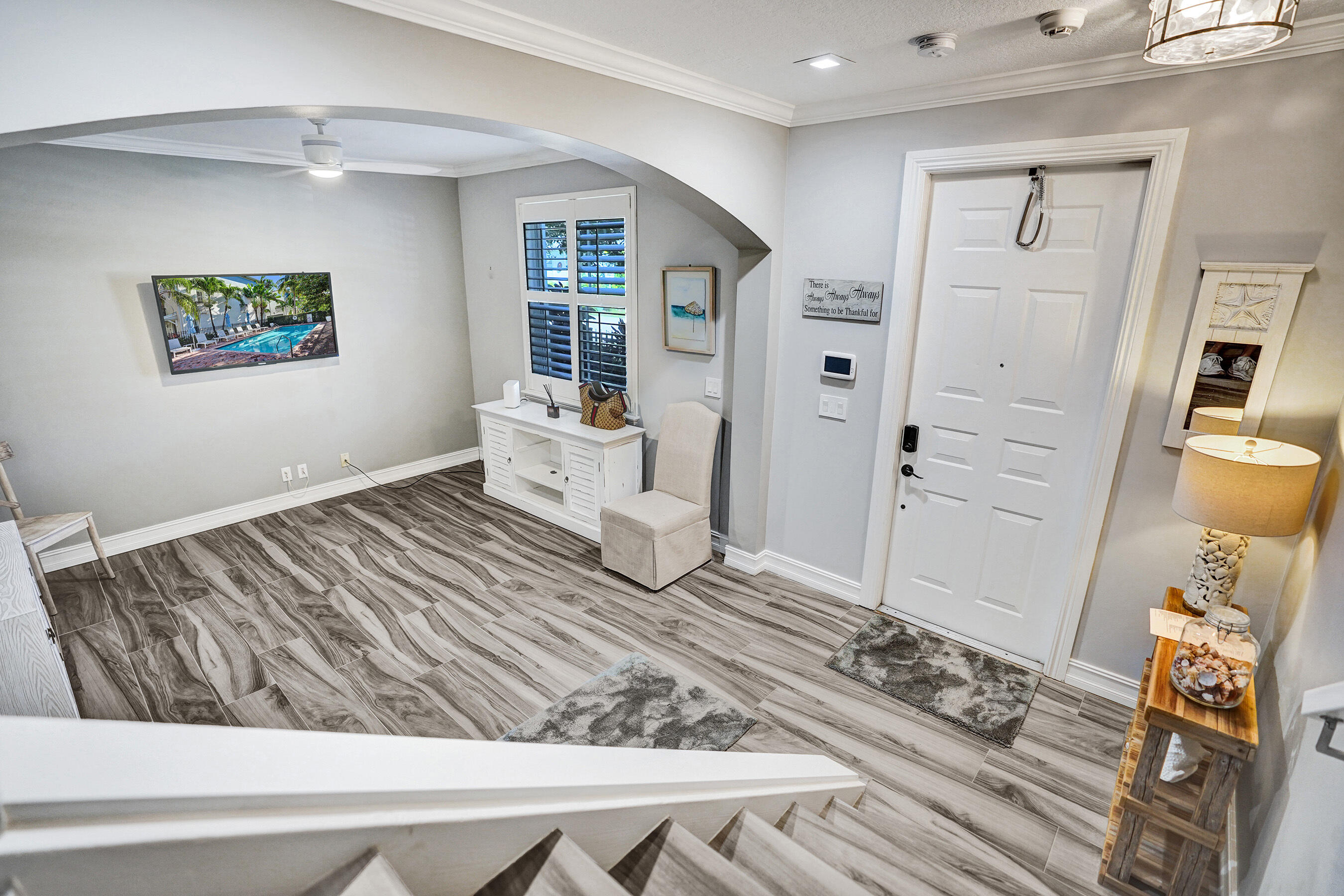 314 Northwest 1st Street Delray Beach, FL 33444 - Photo 22 of 26 a bedroom with a bed and wooden floor