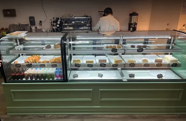 a kitchen counter top with stove and cabinets