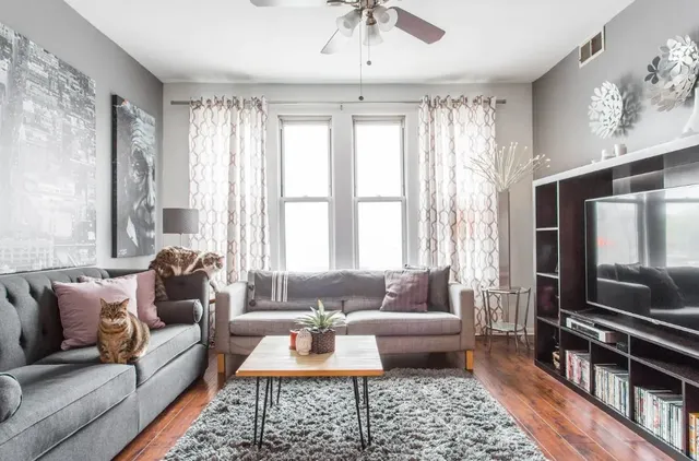 a living room with furniture and a flat screen tv