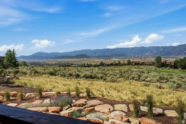 7885 North Rabbitbrush Court, Unit 13 Park City, UT 84098 - Photo 78 of 88 Expansive landscape featuring distant mountains, a valley, and a terraced rock garden with plantings