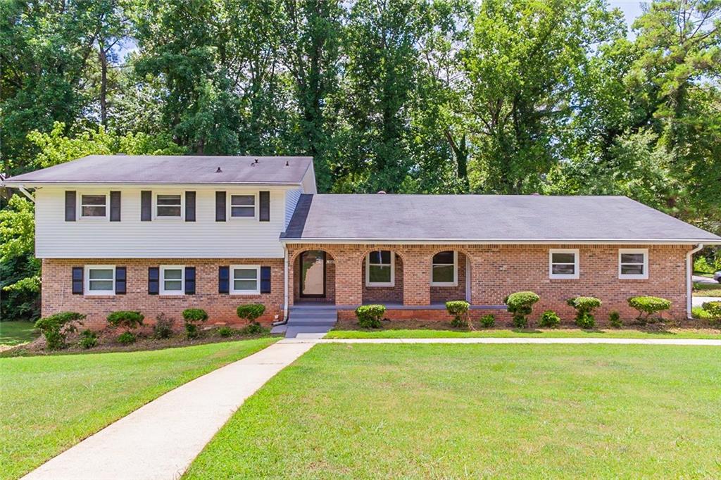 3587 Greentree Farms Drive Decatur, GA 30034 - Photo 1 of 1 a front view of house with yard and green space