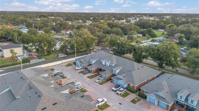 an aerial view of a house with a yard