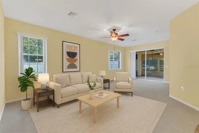 a living room with furniture and a large window