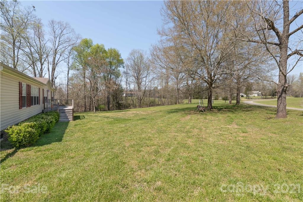 1465 Humphries Road Clover, SC 29710 - Photo 3 of 47 a view of a yard with a tree