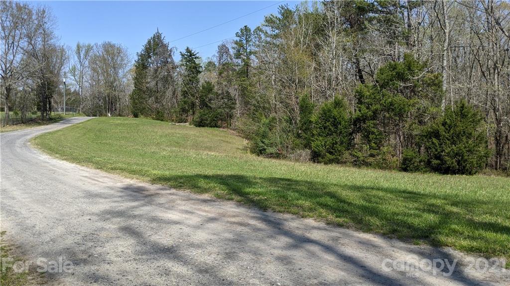 1465 Humphries Road Clover, SC 29710 - Photo 36 of 47 a view of a field with trees in the background