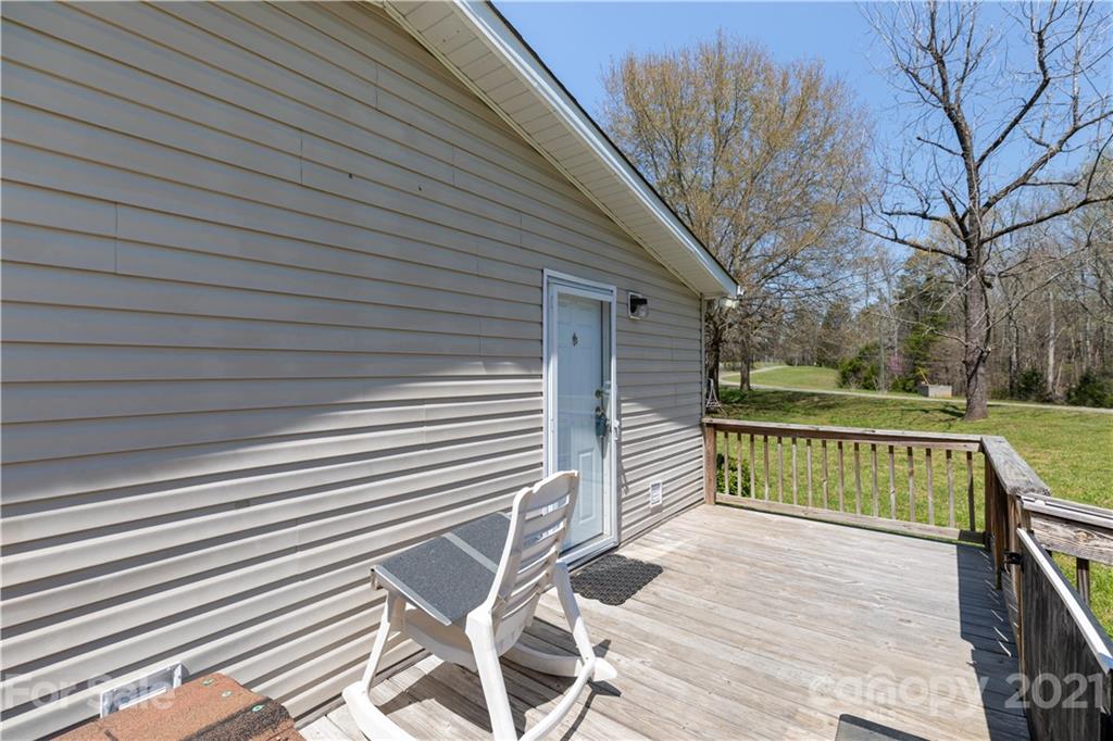 1465 Humphries Road Clover, SC 29710 - Photo 5 of 47 a view of balcony with wooden floor and fence and a bench