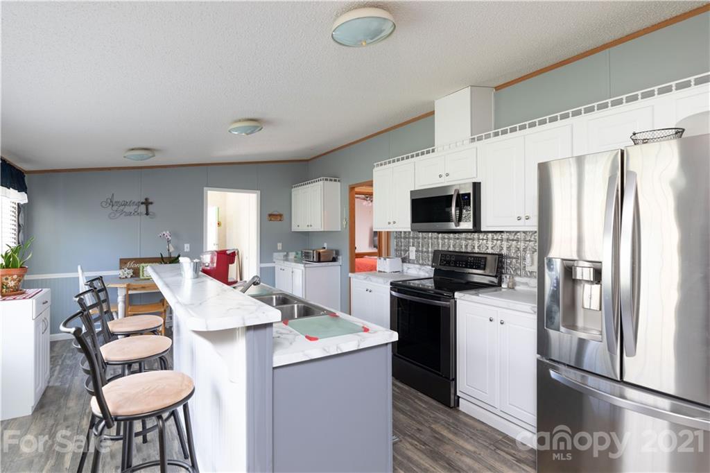 1465 Humphries Road Clover, SC 29710 - Photo 7 of 47 a kitchen that has a cabinets counter space and appliances