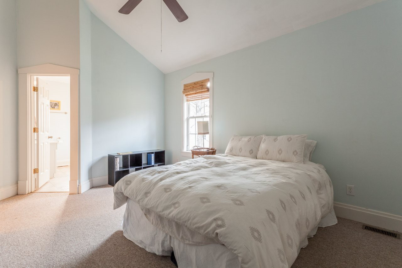 500 Frank Street Raleigh, NC 27604 - Photo 14 of 23 The large master bedroom features cathedral ceilings, a ceiling fan...